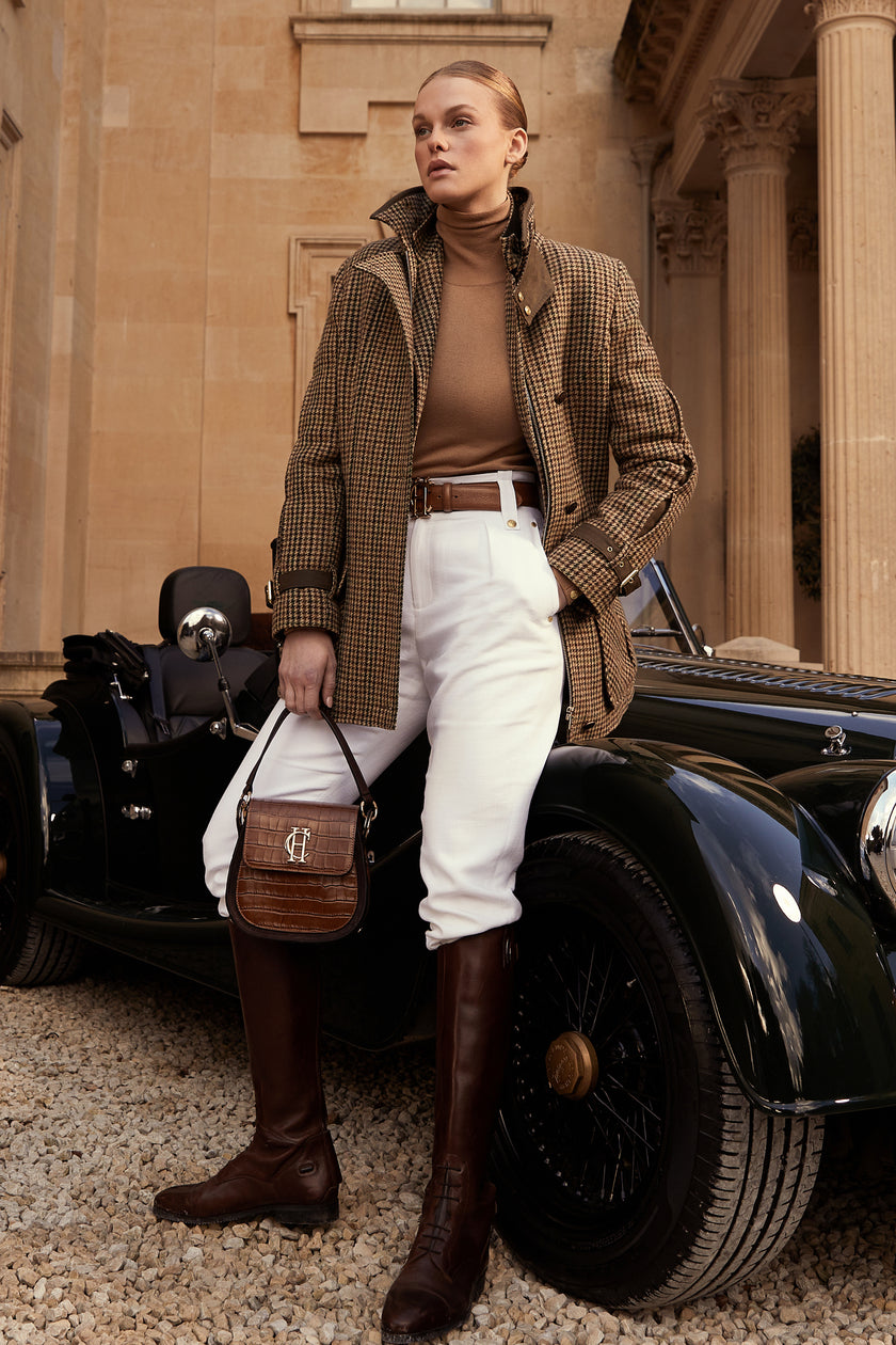 Woman in green and brown tweed field coat