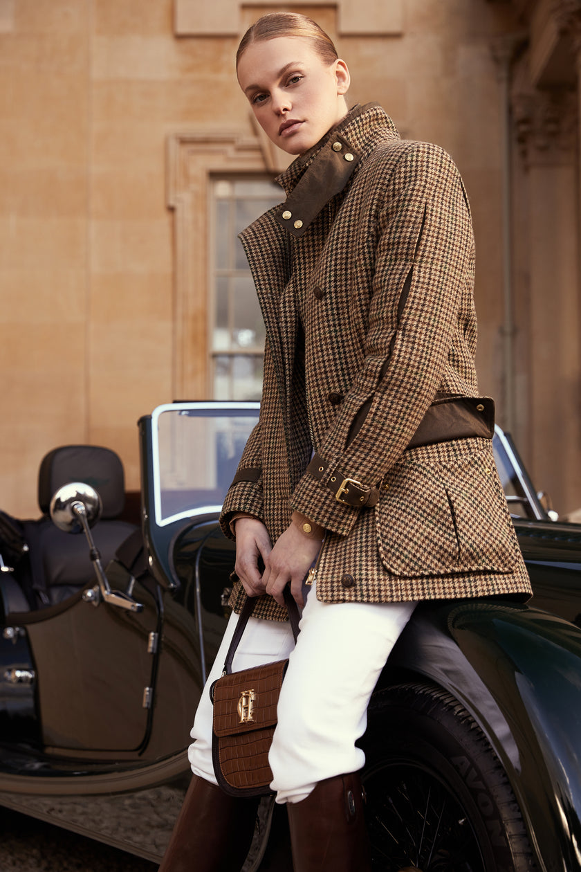 Woman in green and brown tweed field coat