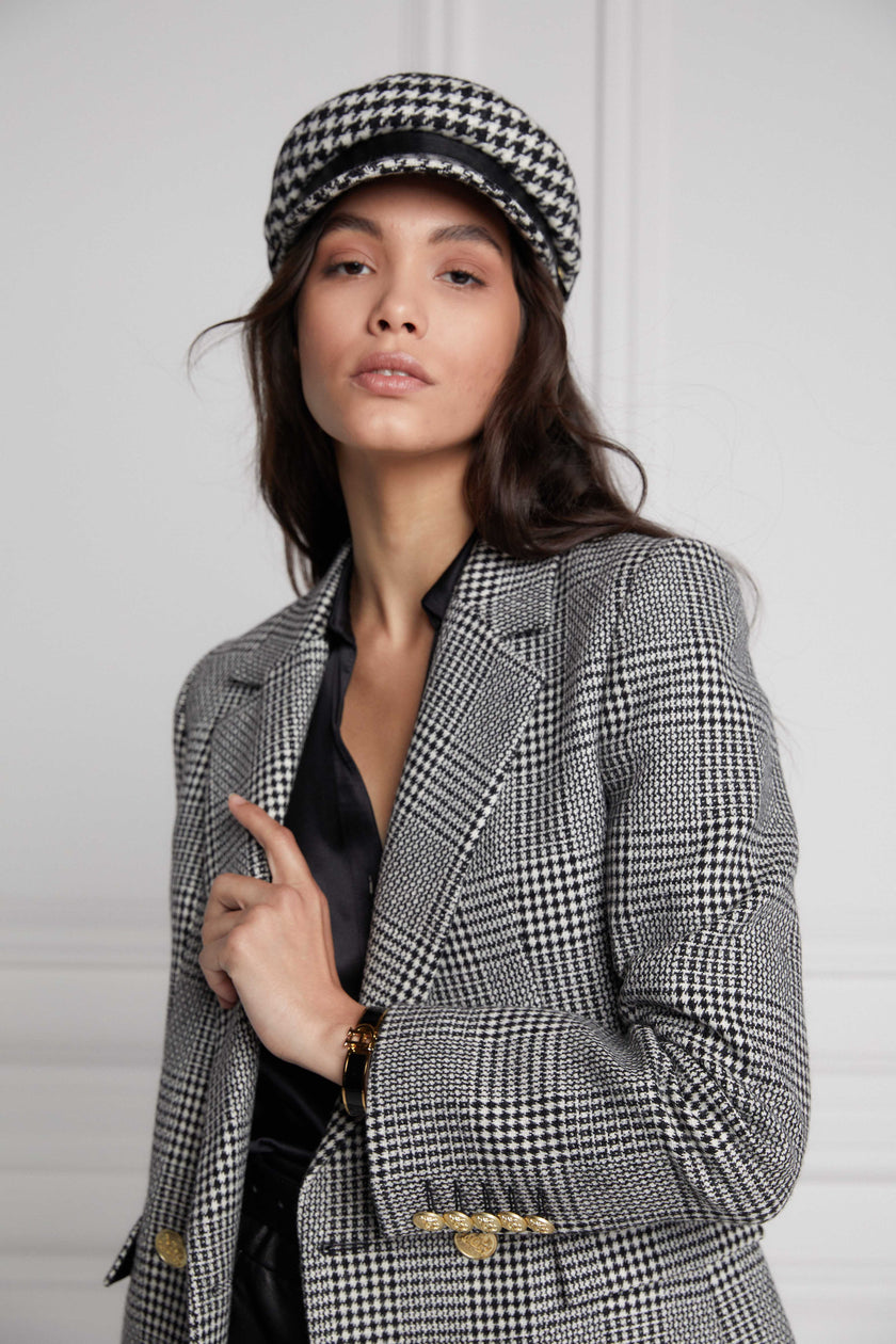 double breasted wool blazer in black and white check with two hip pockets and gold button details down front and on cuffs and handmade in the uk